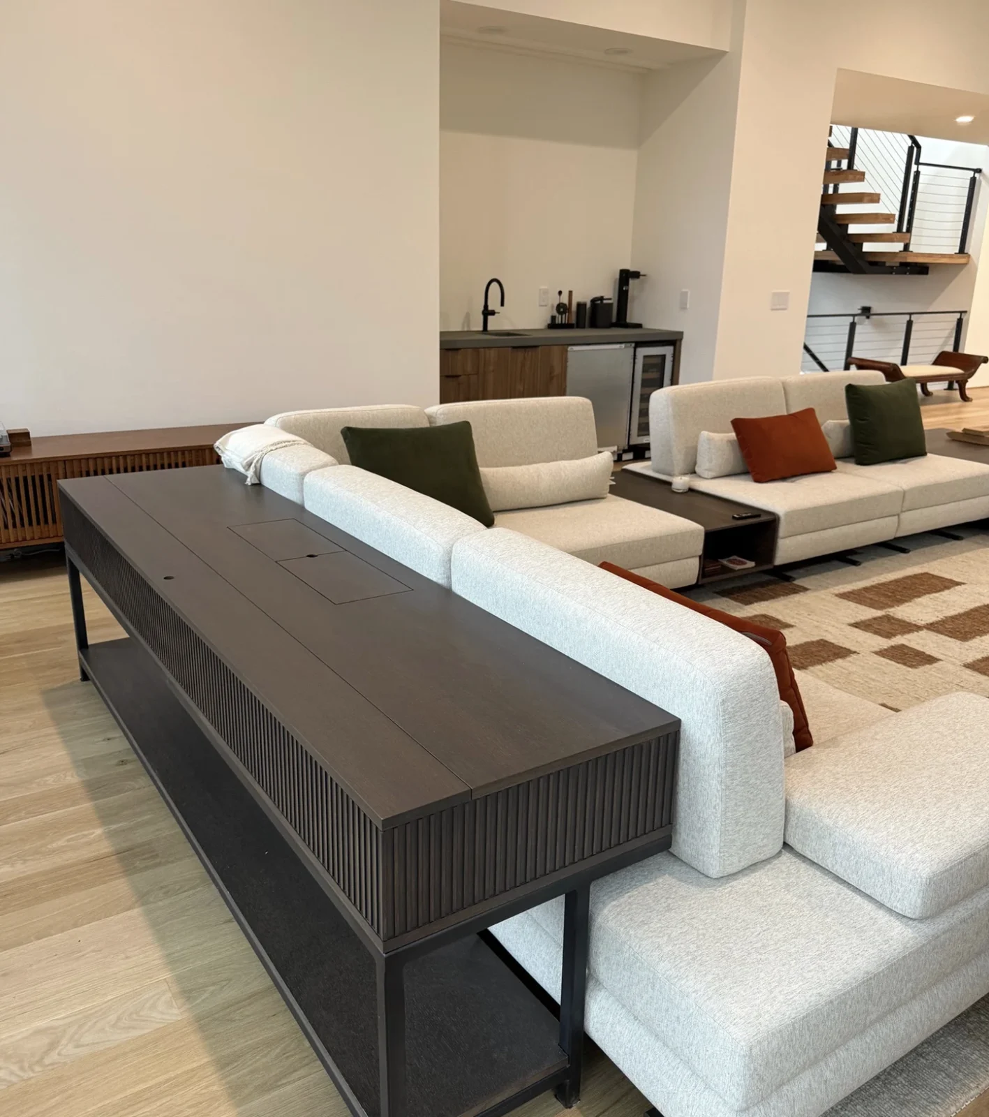 Hudson Table positioned behind a sofa with its screen concealed