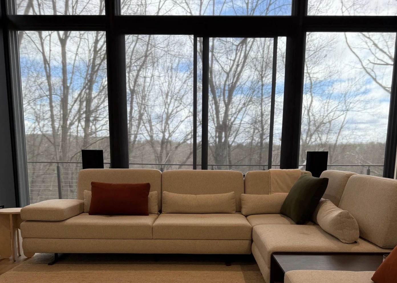 The same living room with the screen concealed behind the sofa